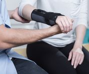 Woman using wrist immobiliser after hand's injury
